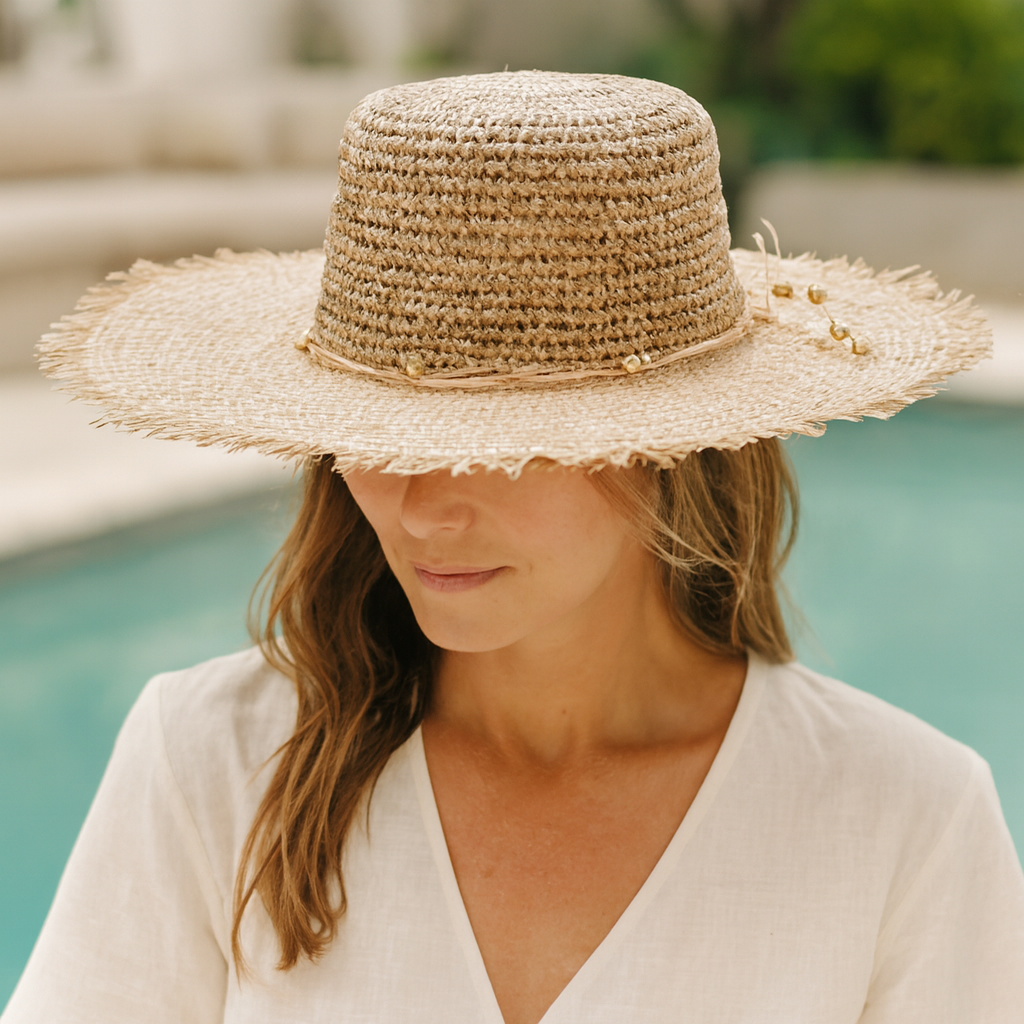 Runaway Seagrass Sun Hat worn poolside
