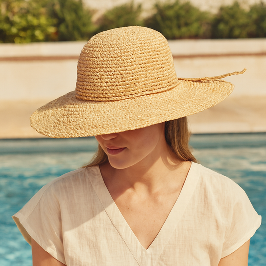 Large-brim raffia sun hat worn poolside