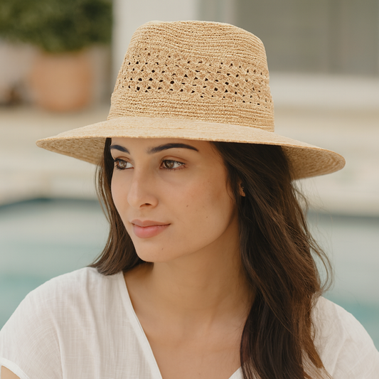 Wide-brim raffia fedora with crochet crown worn poolside